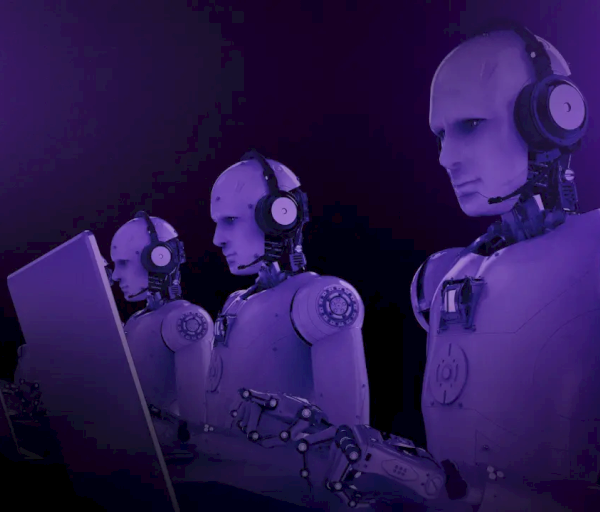 The image shows three humanoid robots wearing headsets, working at laptops in a dark, purple-lit environment.